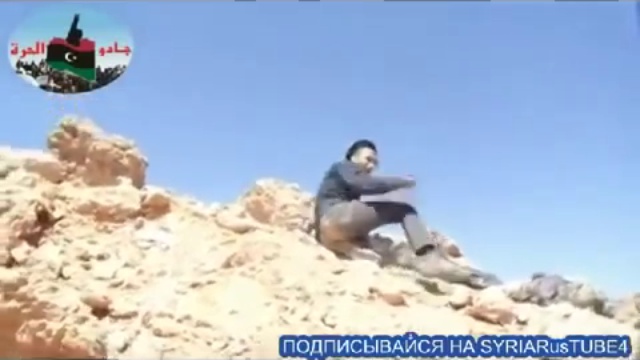 СИРИЯ  ТЕРРОРИСТ ЛОВИТ ПУЛЮ ГОЛОВОЙ