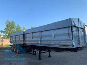 Самосвальный полуприцеп с двумя отдельными самосвальными платформами.