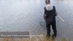 A Camera Crew follow a boy closely at a Fishing Competition.