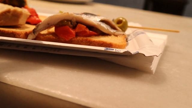 Eating tapas in Spain at a Spanish market (San Miguel Mercado, Madrid Spain)