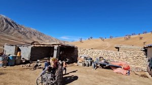 Busy day for a nomadic family. Temurt heat-insulates the greenhouse and cements the roof of the roo