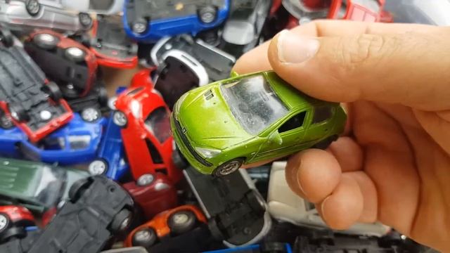 Box full of welly cars  in 1:60 scale