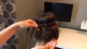 Высокая прическа с косой и использованием валика