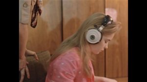 Natalya Dmitrievna Vavilova(Aleksandra) wears vintage headphones in Moscow Does Not Believe in Tear