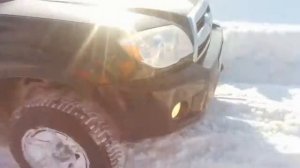Toyota Hilux SURF 4.0 and snowy hill