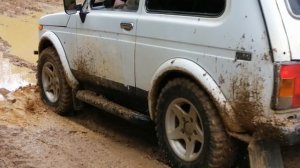 Нива и уаз на военных мостах в лесу