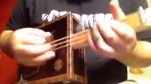 Piccolo cigar box guitar by Shane Speal