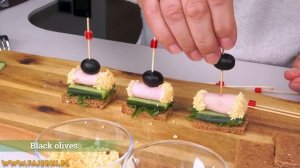 Finger food ideas for party. Triangular stuffed with paste, mini rolls, cheese roses