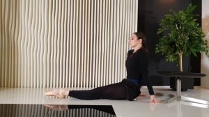 Flexible ballerina stretching in a photo studio. Contortion routines.