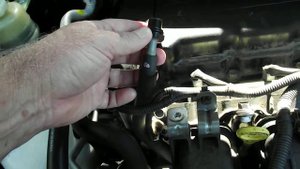 Removing and checking the PCV valve on a 2010 Mitsubishi Outlander 2.4 petrol engine.