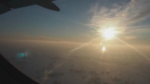 Взлет самолета в аэропорту Толмачево (Новосибирск) на закате в марте.
