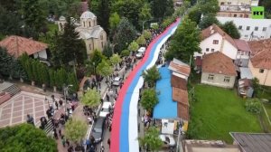 Giant Serbian tricolor unfurled in protest against NATO troops in Kosovo