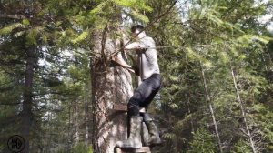 Installing a zipline in our forest with my sons.