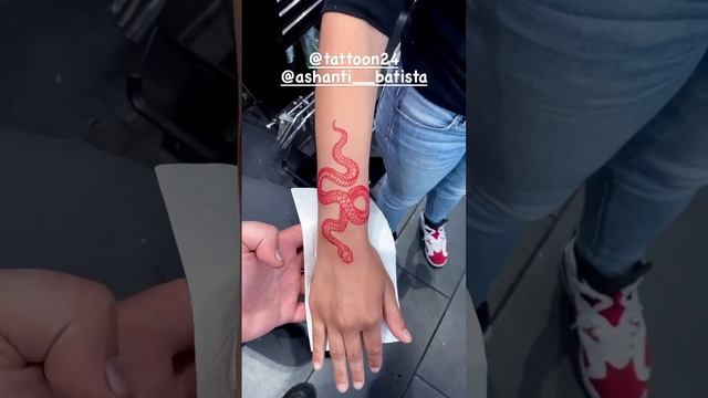 Red snake tattoo