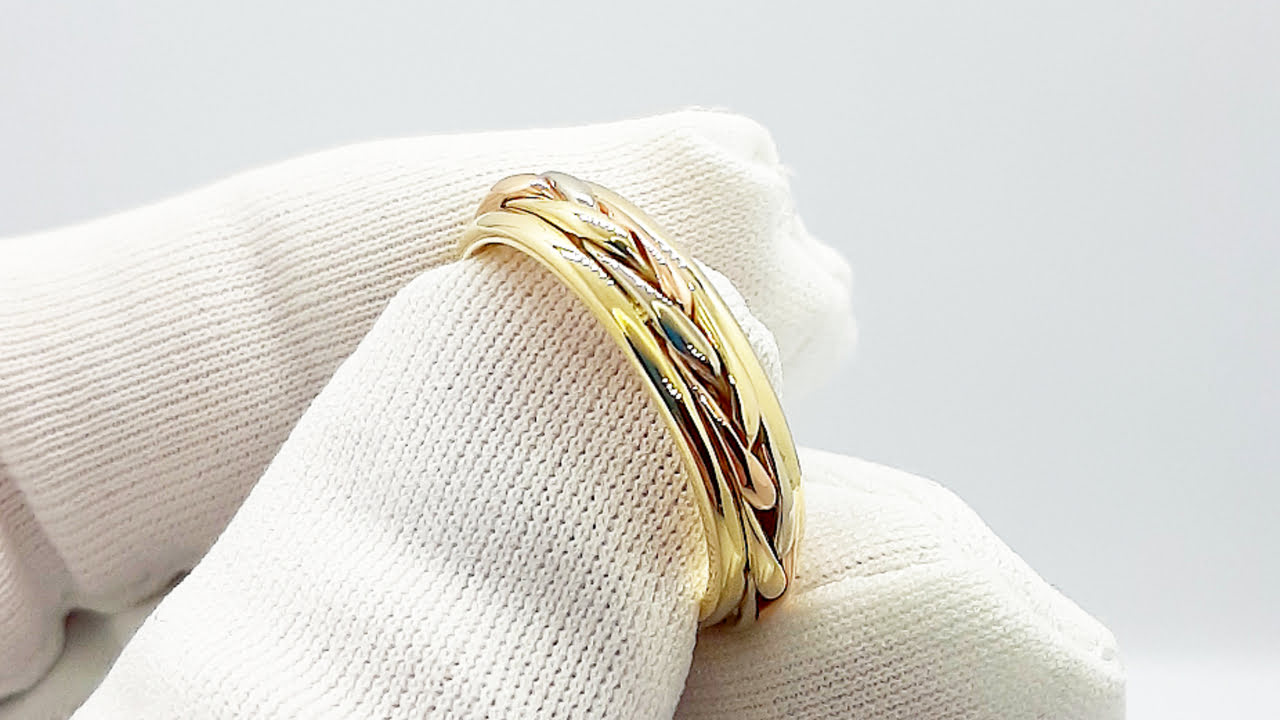 Обручальное кольцо косичка из трех видов золота