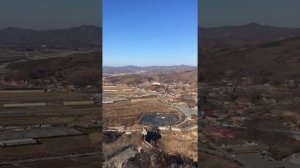 First view of North Korea from the Great Wall of China in Dandong.