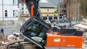 Building demolition with Hitachi KMC 600 P - Kiesel Multi Carrier. 4K - Drohne