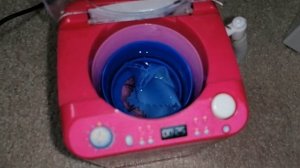 Toy washing machine modified rinse and spin