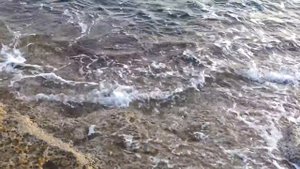 Закат на крайней скале пляжа Sandy Bay.