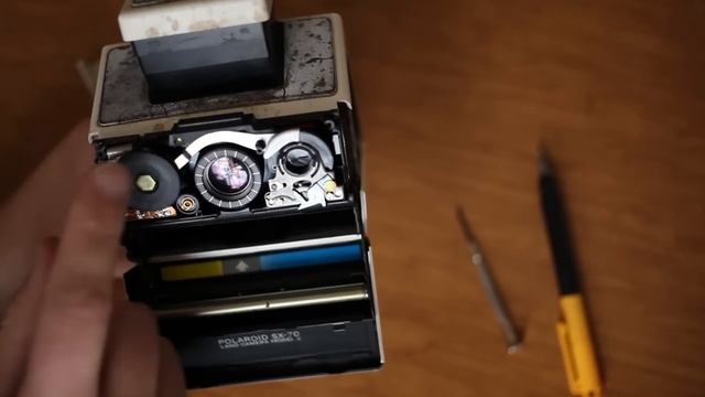 How to remove front cover (aka shutter housing) on a Polaroid SX-70 to fix a stuck/jammed focus. смотреть онлайн