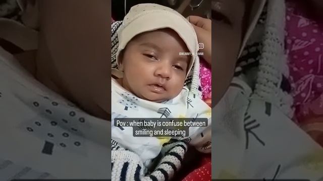 When a baby is confused between smiling and sleeping #baby #cute #cutebaby #shorts