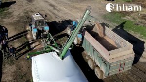 Распаковка рукава для хранения зерна с помощью зерноразгрузочной машины МЗР
