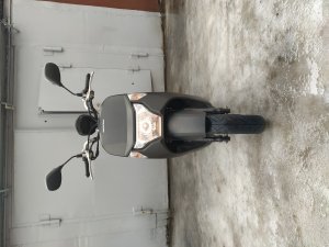 По пробкам на скутере