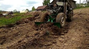 Работа минитрактора с отвалом