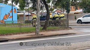 SA MFS firefighters push rolled Holden Jackaroo back onto four wheels