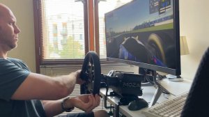 Moza R9 on desk, CS wheel, SR-P pedals.