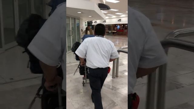 Mexico City Benito Juarez airport staff helping with luggage