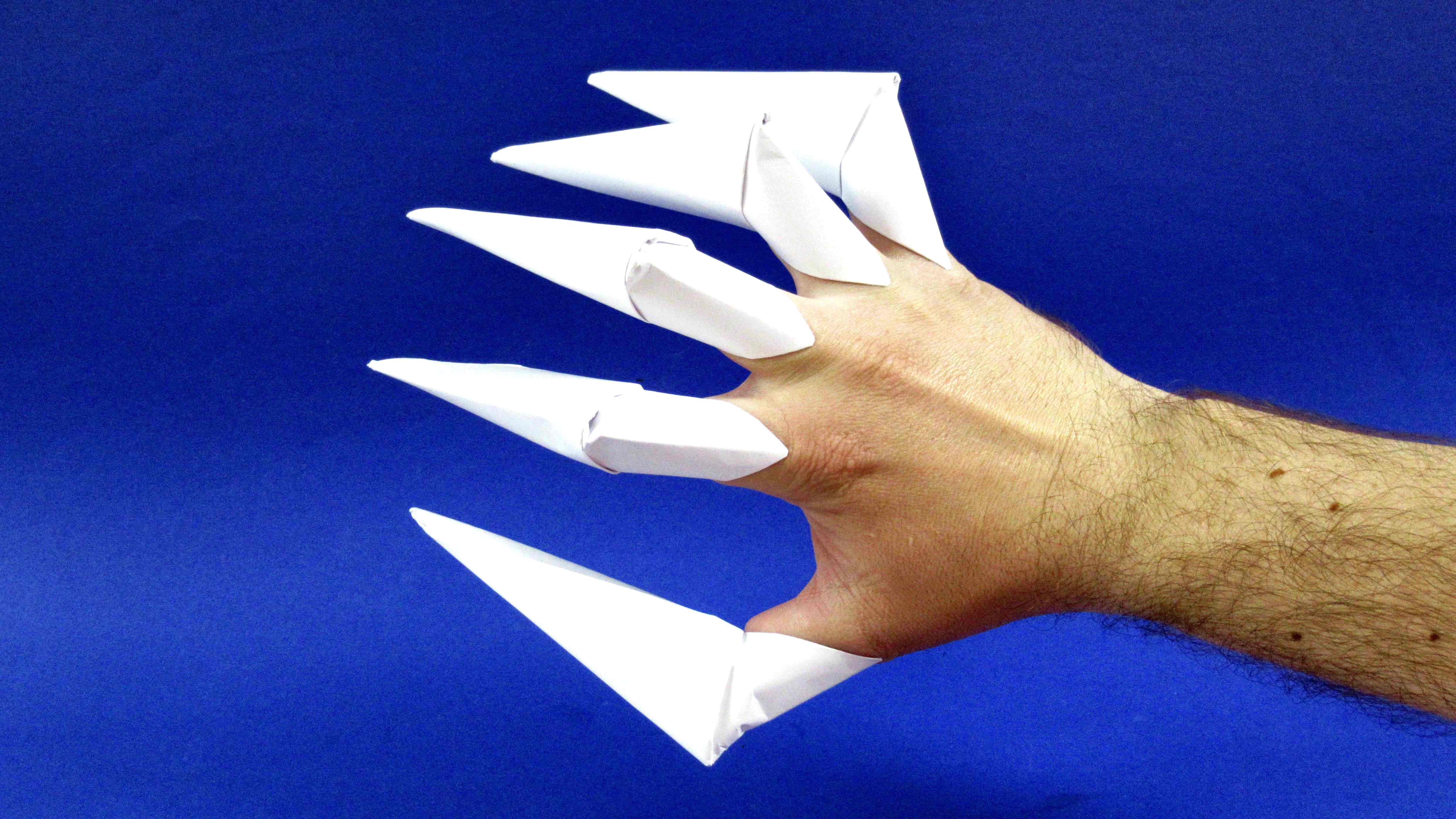 Дракон на палец из бумаги. Оригами когти. Когти из бумаги. Бумажные когти оригами. Бумажные когти на пальцы.