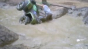 Arctic Cat 650h1 in mud hole almost goes over