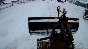 Чистка снега самодельным отвалом на минитракторе.
