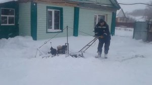 Самодельный мотобуксировщик с отвалом.