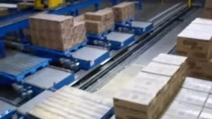 Укладка картонных коробок с продукцией на палету роботом Kawasaki