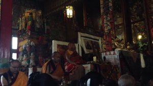 Tibetan Buddhist monks chanting in monastery in Nepal during a special puja