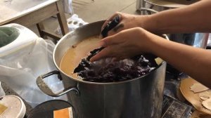 Close up of fabric removal from the batik boil pot-- after cooling completely