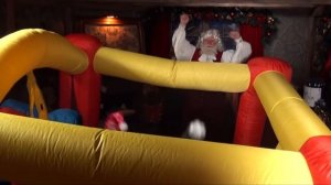 Santa cam: Santa at the North Pole with elves testing a new Bouncy Castle!