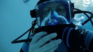 Female Diver is Diving with Neoprene Wetsuit and OTS Full Face Mask in Pool