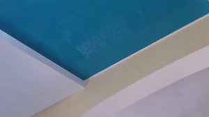 Двухуровневый натяжной потолок с бирюзовым глянцем