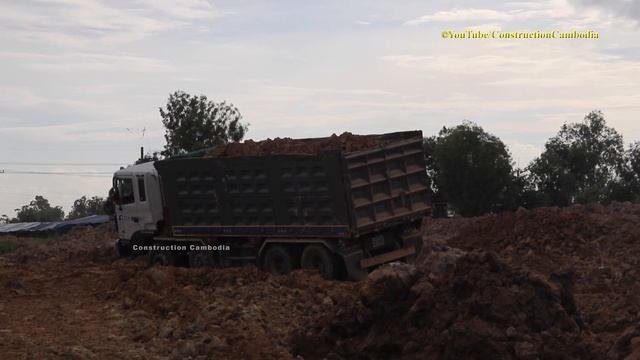 Bulldozer Equipment Land Pushing With Extreme Dump Truck Unloaing Land
