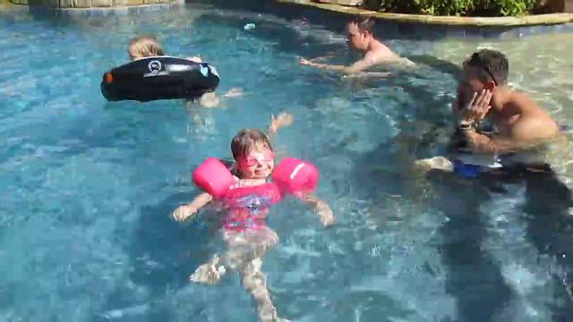Olivia as SUPERMAN! jumps into the pool