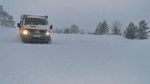 Ford transit 4x4 Adventure camper playing in snow.