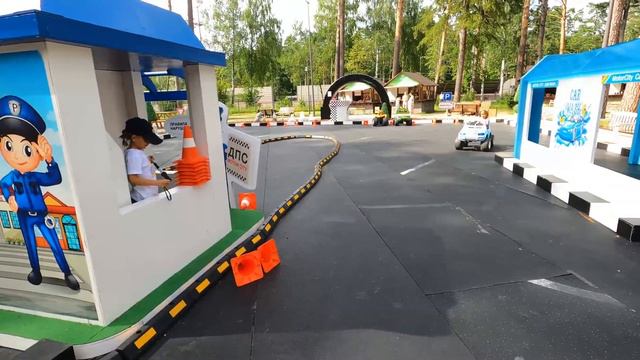 Milana and NIka play with car on playground for Kids.