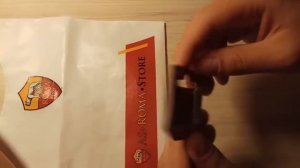 Подарки из Рима и маленькая коллекция клубных значков.