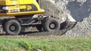 Работа полноповоротного экскаватора JCB 160W