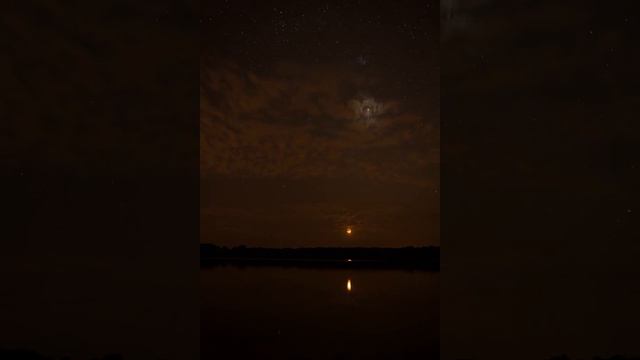 Moon and Venus setting photobombed by starlink satellites.