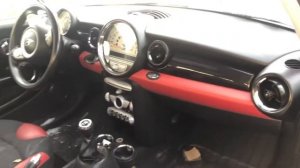 The fuse box location on a 2010 Mini Cooper
