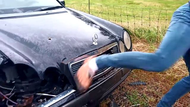 Idiot with wooden shoes destroy's avantgarde Mercedes-Benz